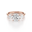 Round-cut Three Stone Engagement Ring with Round Side Stones in Gold