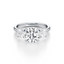 Round-cut Three Stone Engagement Ring with Round Side Stones in Gold