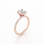 Oval-cut Secret Halo Engagement Ring with a Pavé Diamond Band